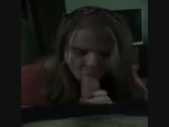 A blond, breasty, overweight whore is greedily licking my weenie.